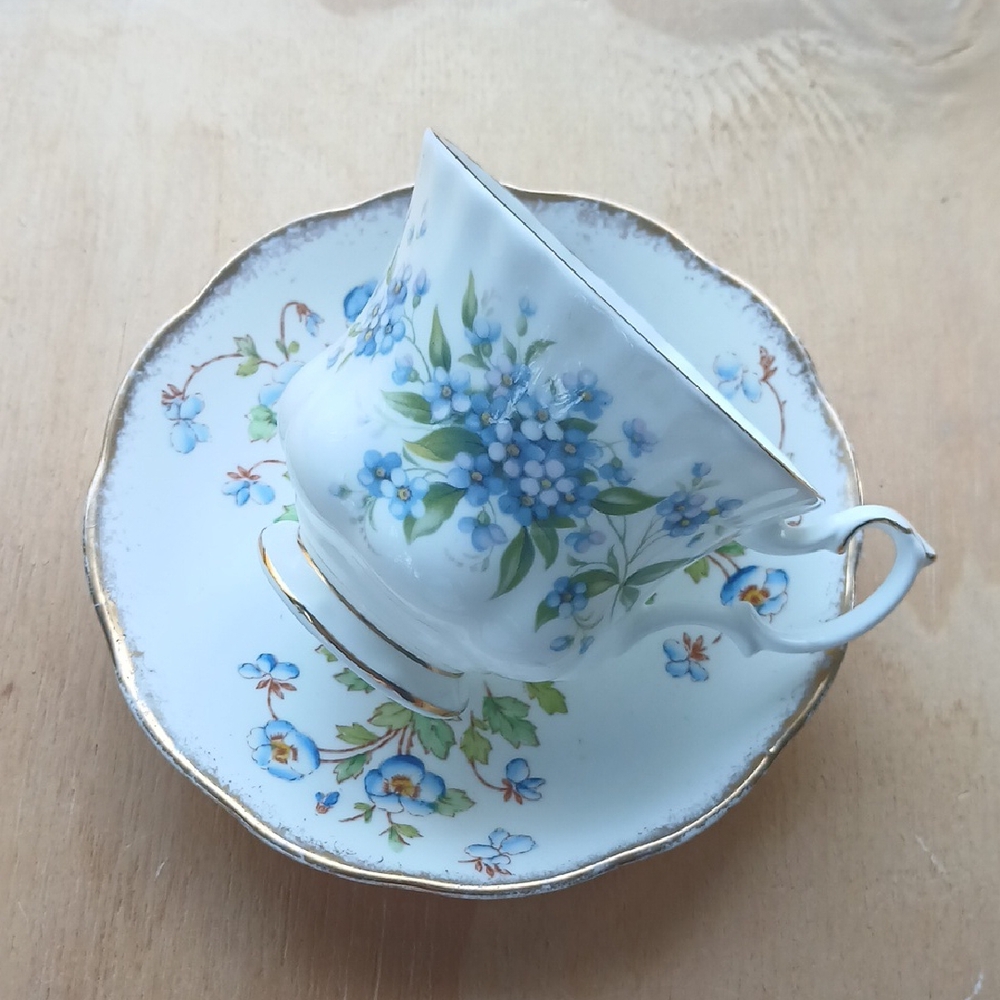 ROYAL ALBERT Beautiful White China with Blue Floral Accent Saucer and Cup Set
